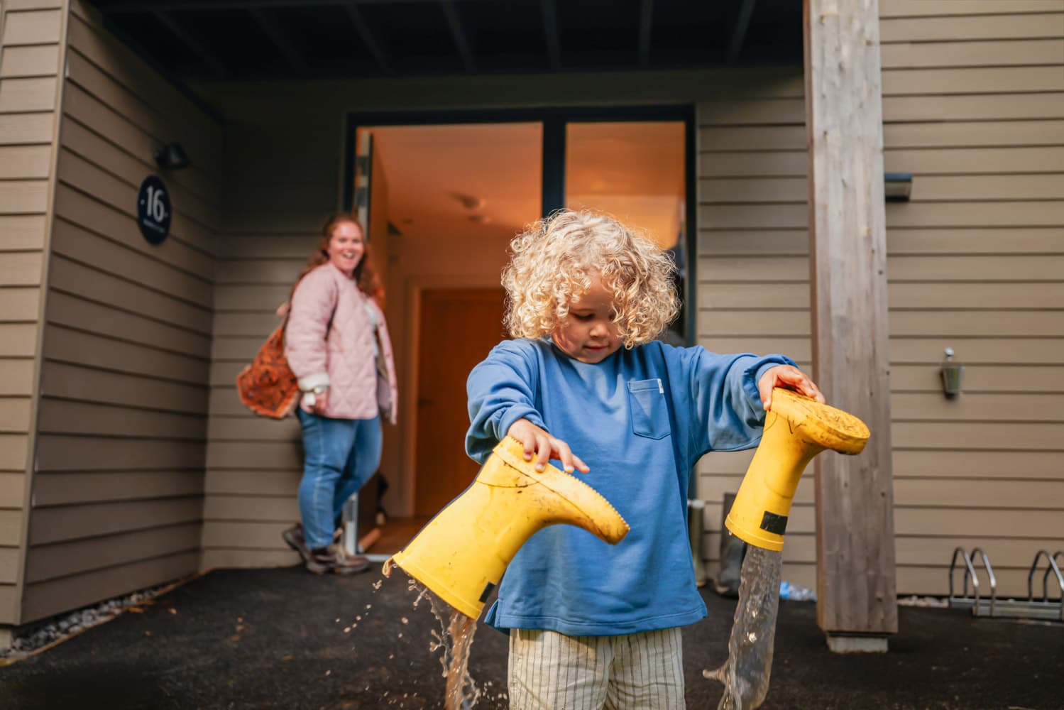Boy Outside Carningli Holding Wellies