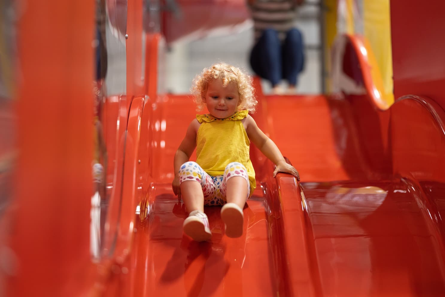 Girl On Slide On Play Tower