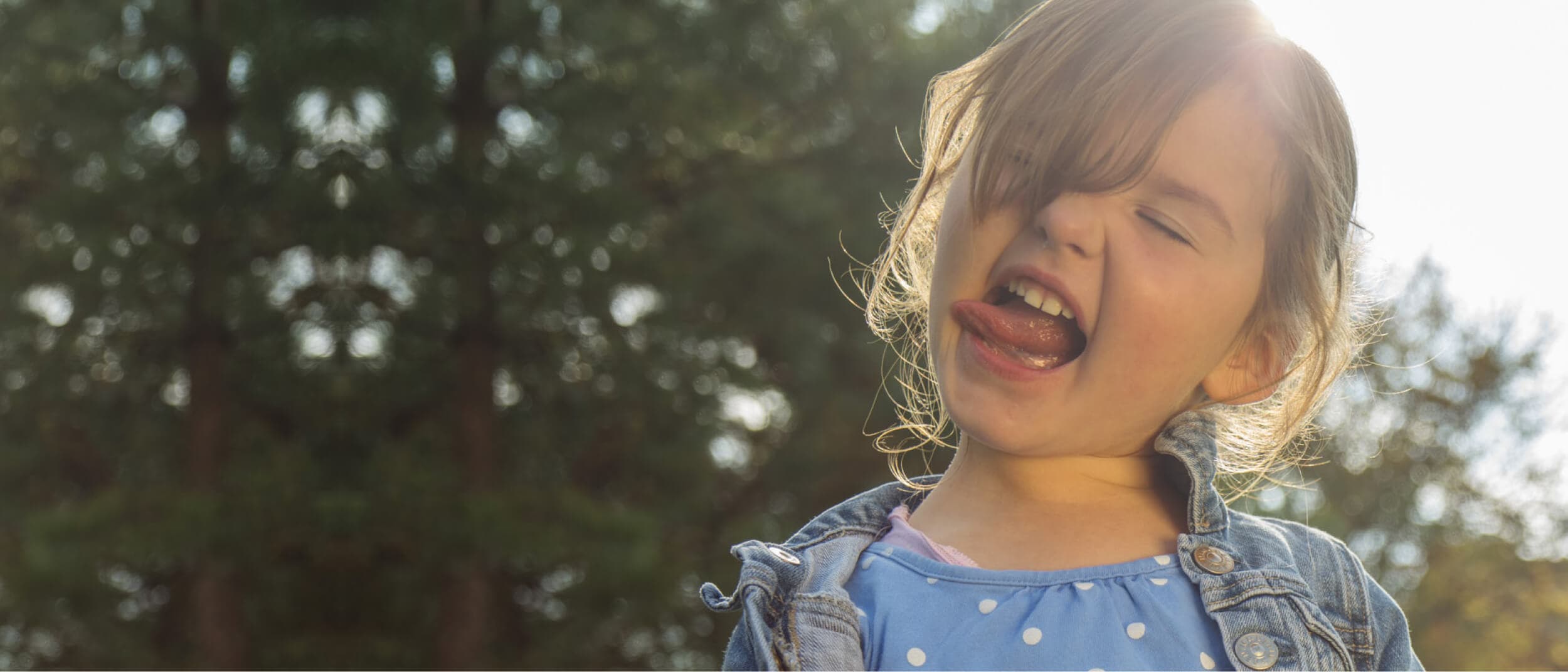 Child smiling with tongue out