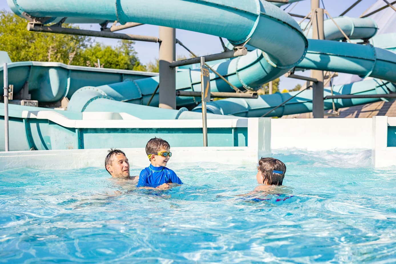 Family In Blue Lagoon Outdoor Pools