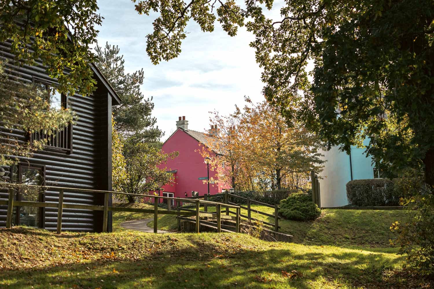 Lodge And Cottages And Autumnal Trees