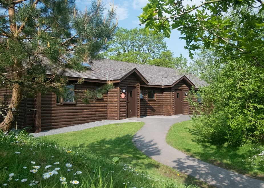 Caldey Lodges through trees