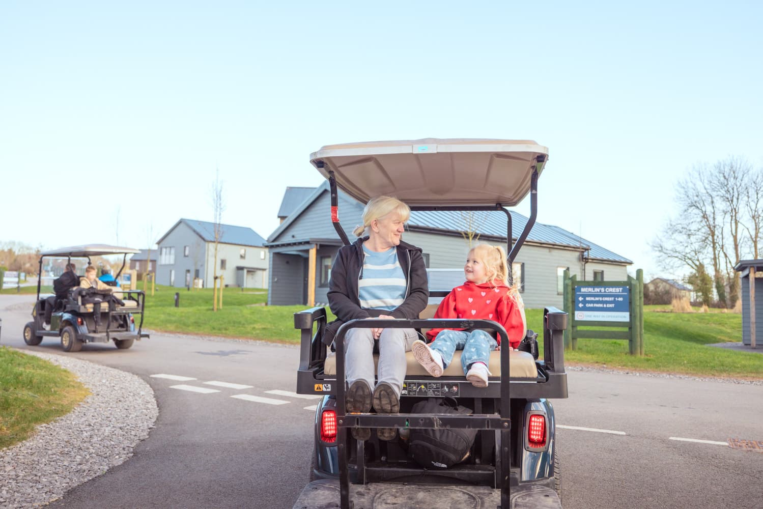 Family On Golf Buggy