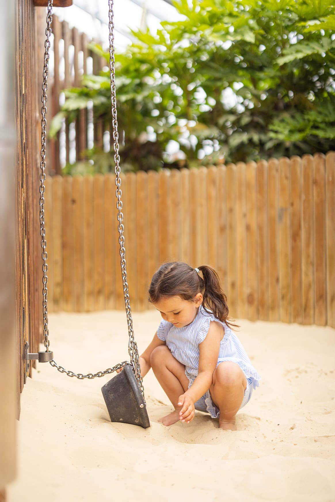 Girl Playing In The Sand