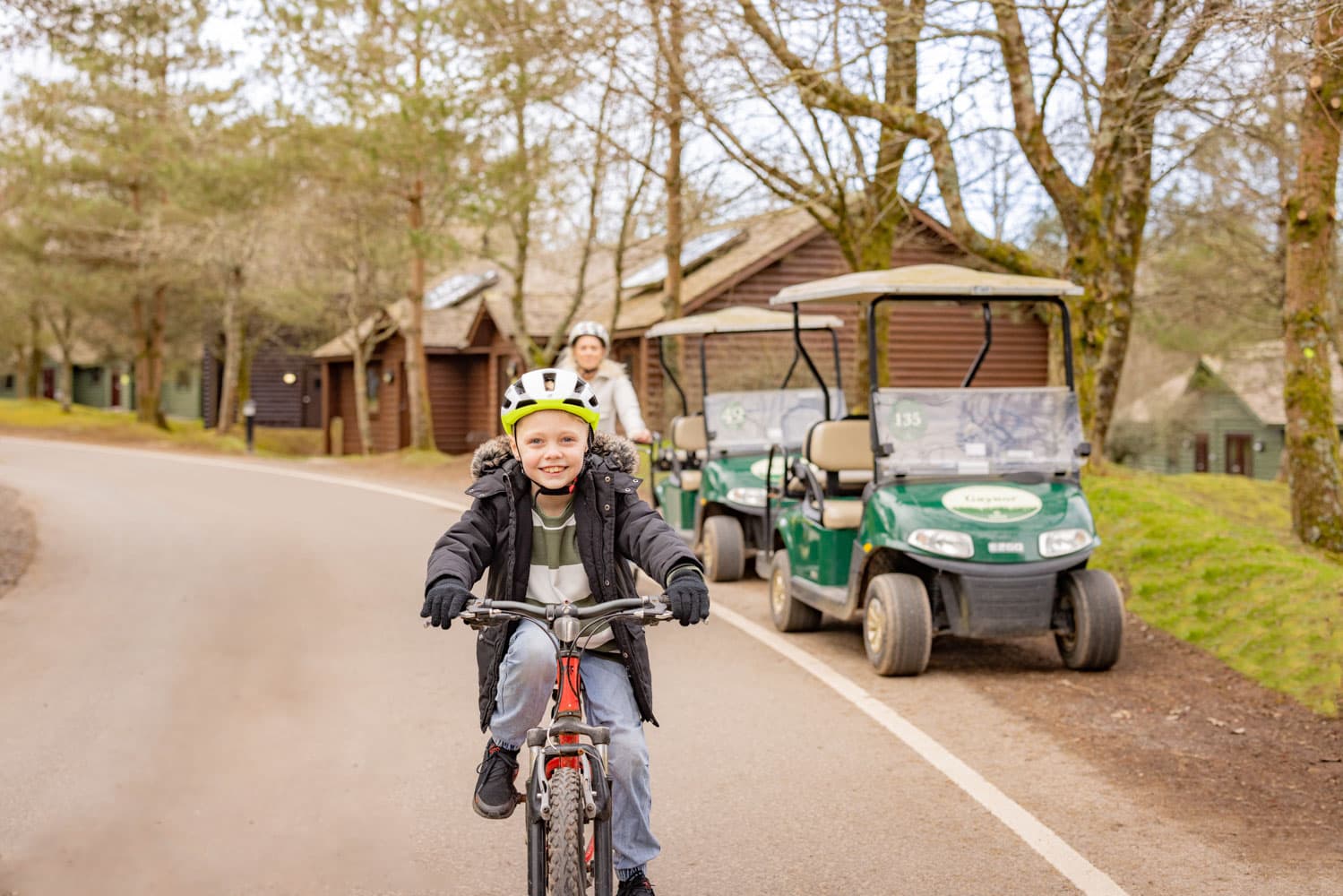 Smiley Boy Riding Bike In Autumn
