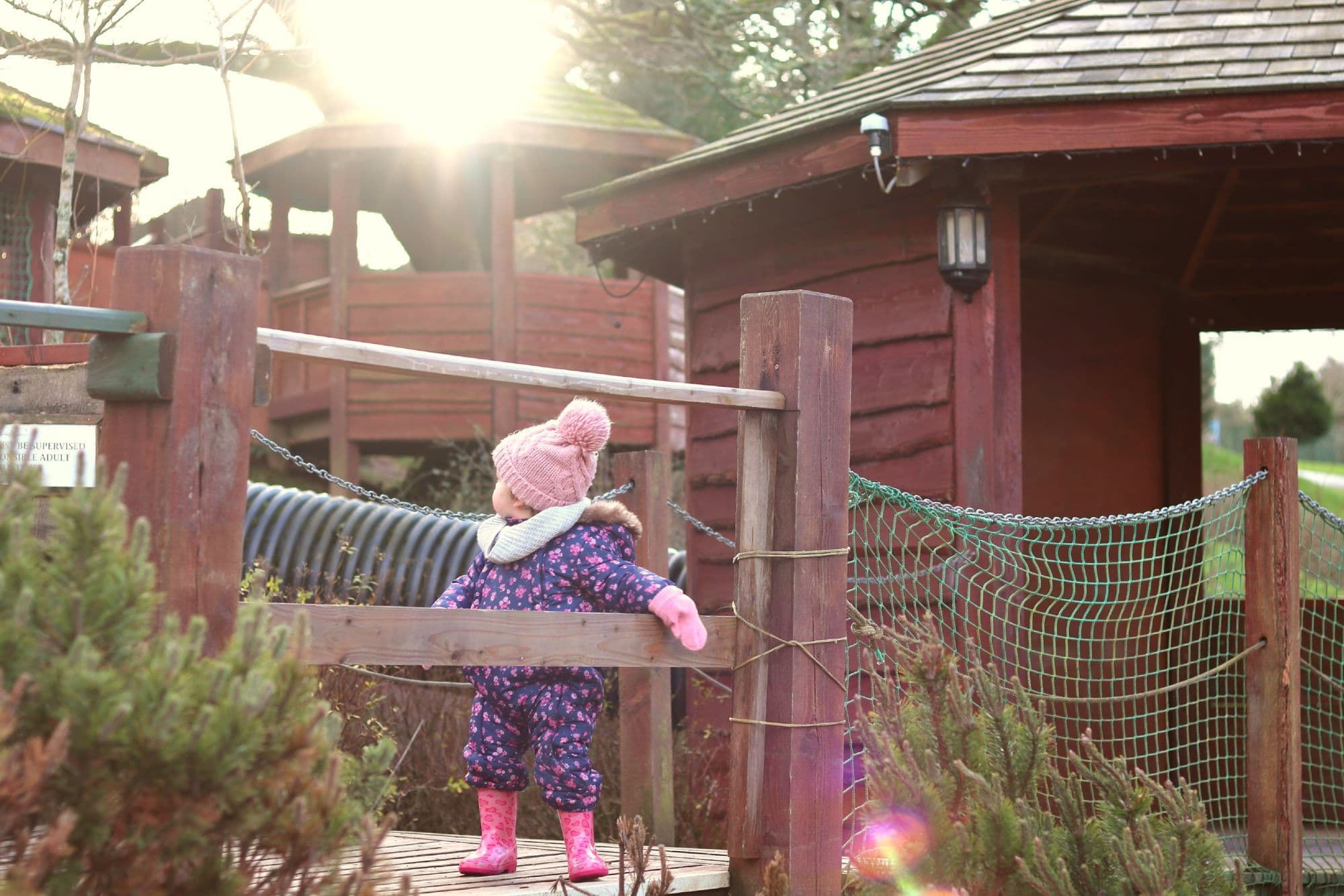 Girl In Wooly Hat In Playground