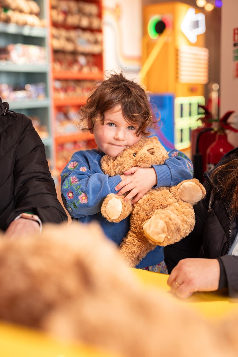 Child With Bear In Bear Boutique
