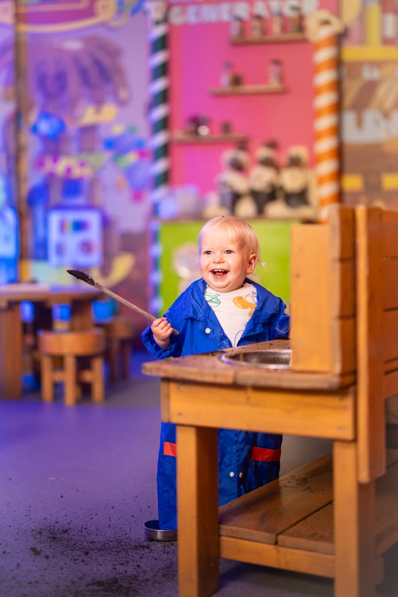 Happy Child Playing At Messy Play