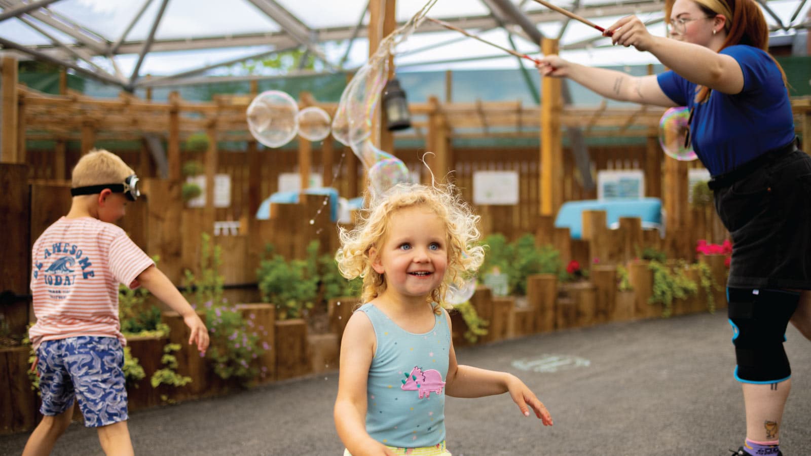 Girl playing with bubbles Serendome Bluestone