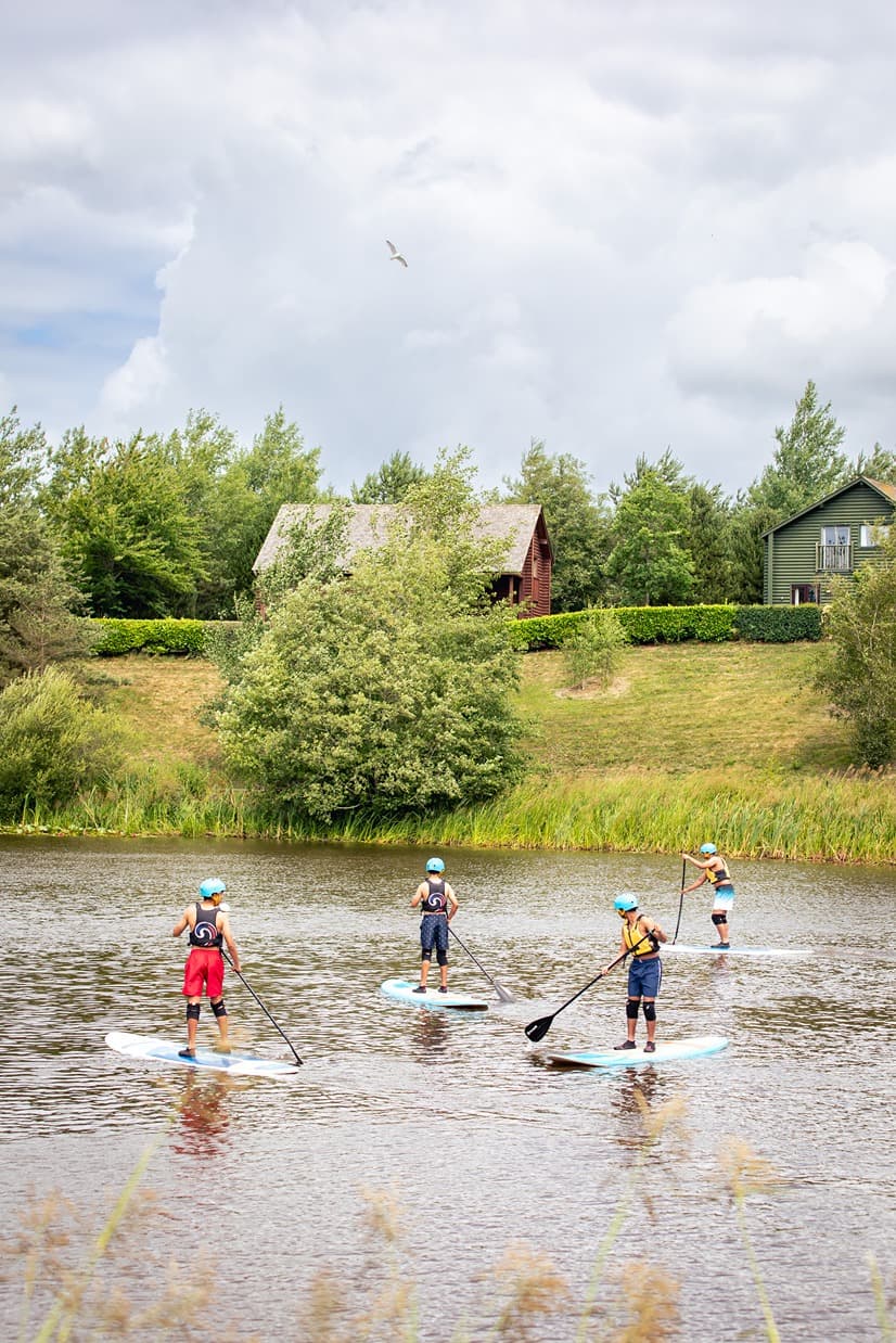 Group Paddleboarding On Bluestone Lake