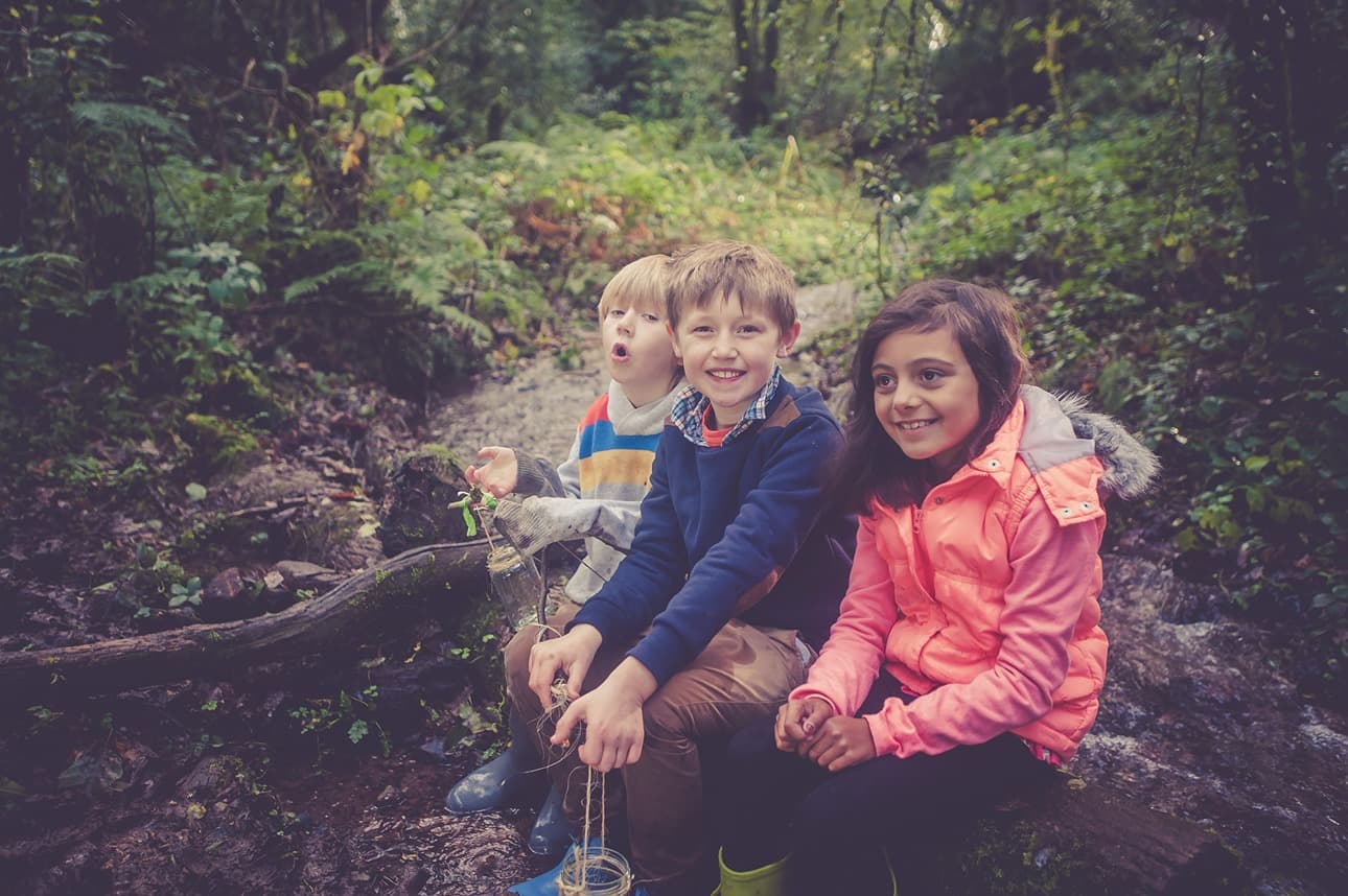 Kids Sat On A Log