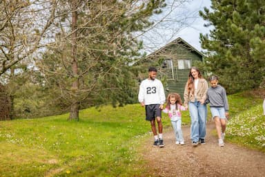 Family outside lodge Bluestone