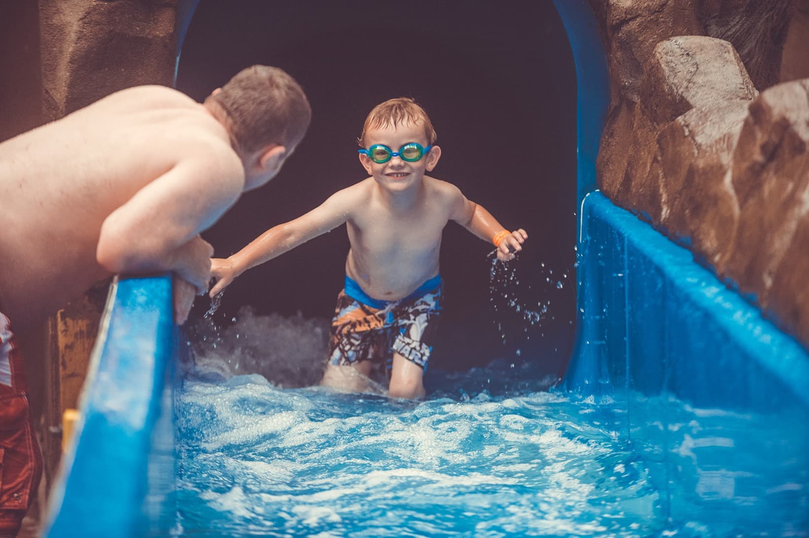 Boy smiling on the Blue Lagoon flumes