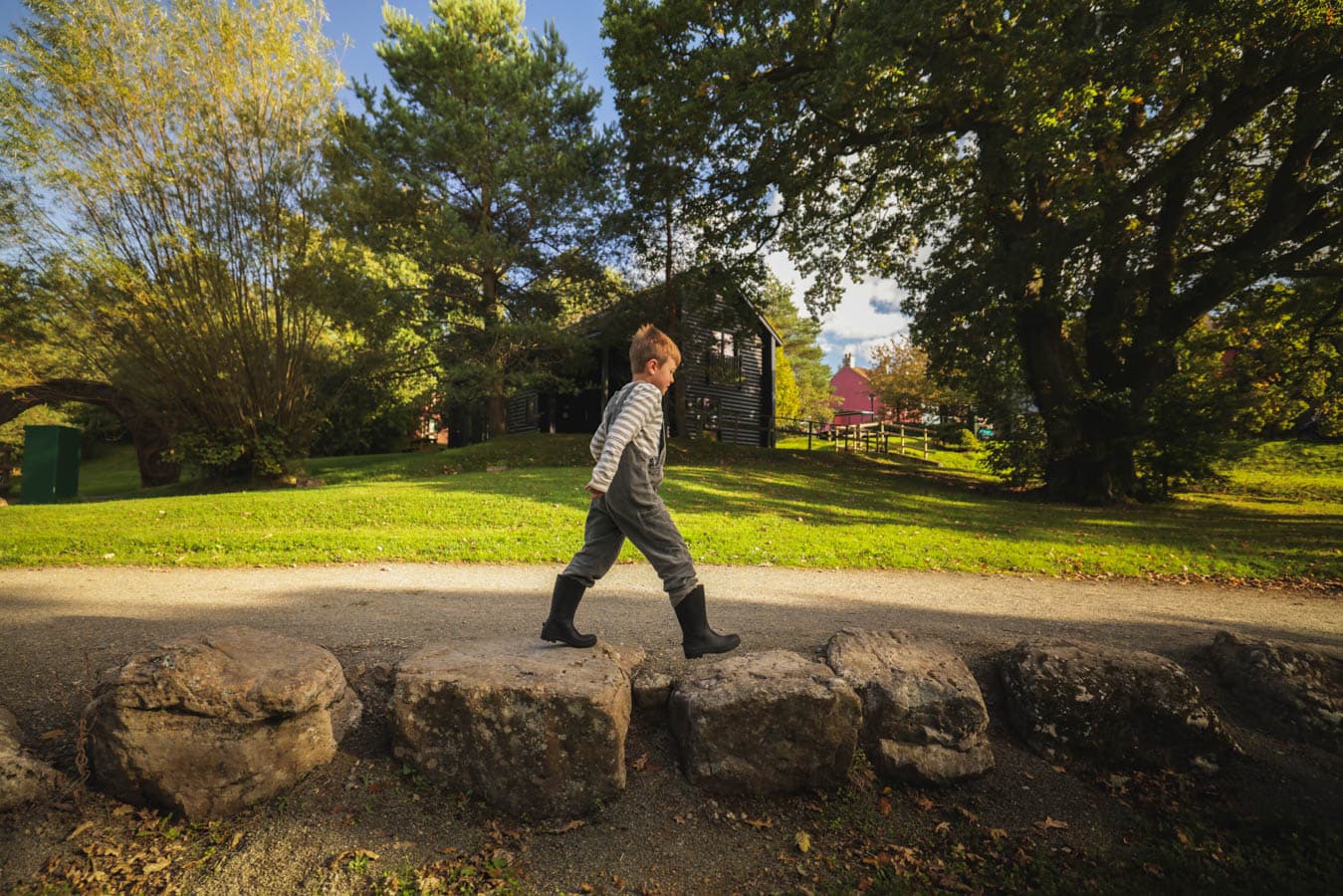 Boys playing outside lodge Autumn
