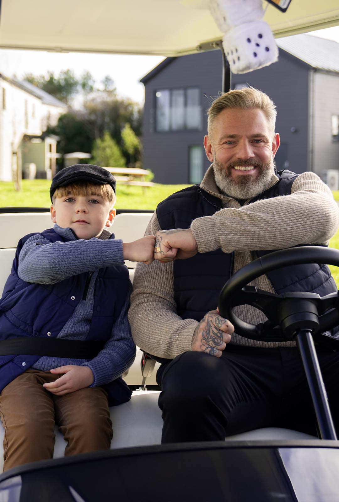Child and Dad on Buggy fist pump