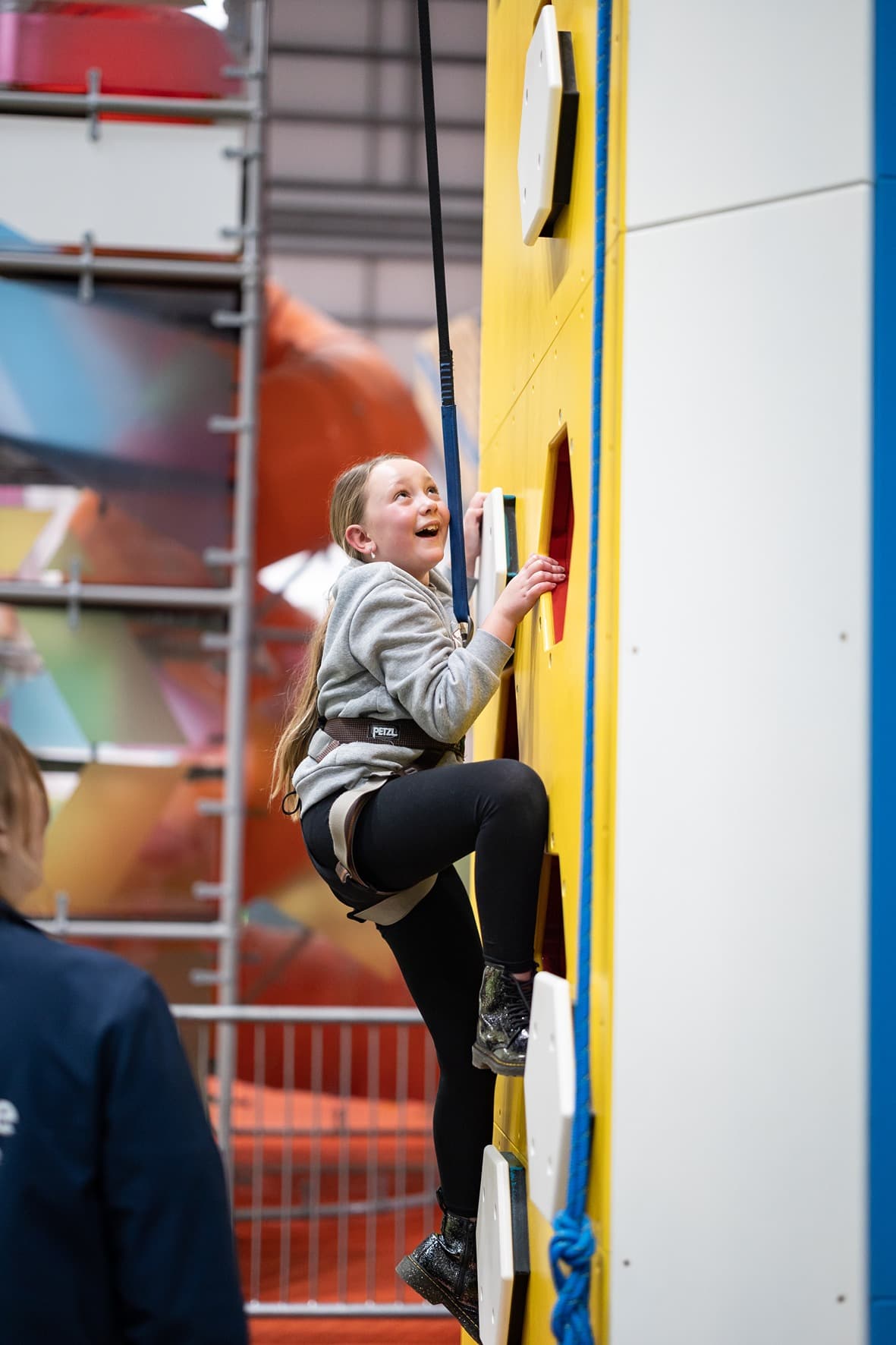 Girl Climbing Power Tower In The Hive