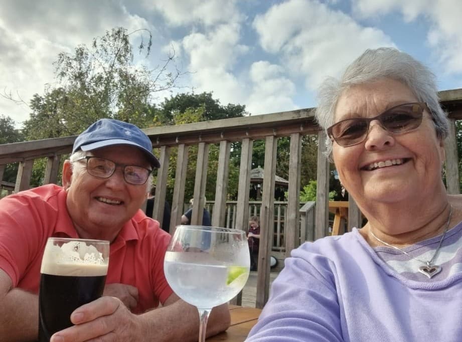 Margaret And Brian With Drinks Outside