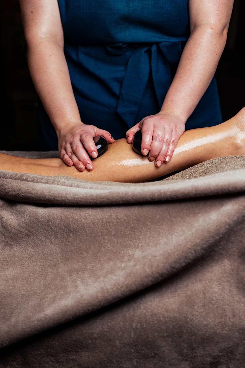 Massage using hot stones