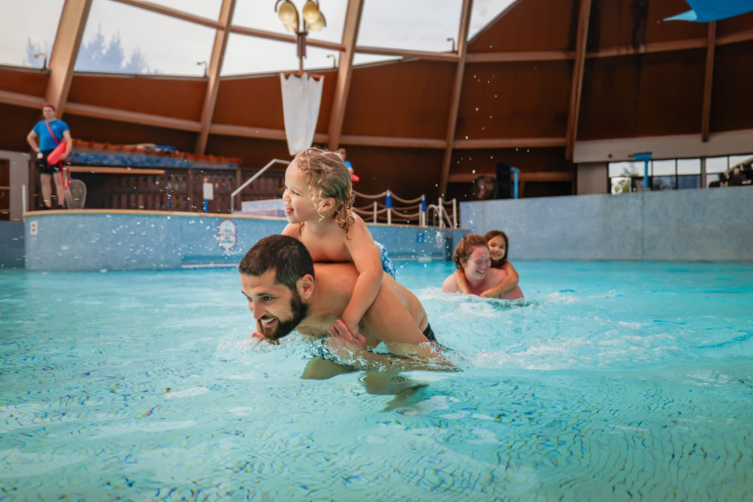 Blue Lagoon Family Piggy Back In Pool