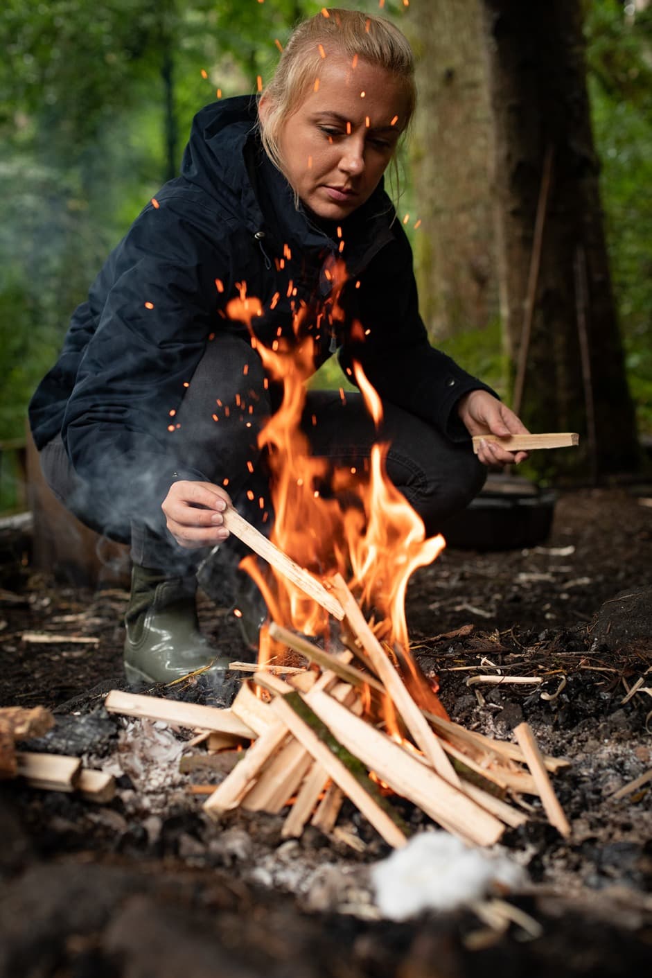 Bushcraft Woman Tending Fire
