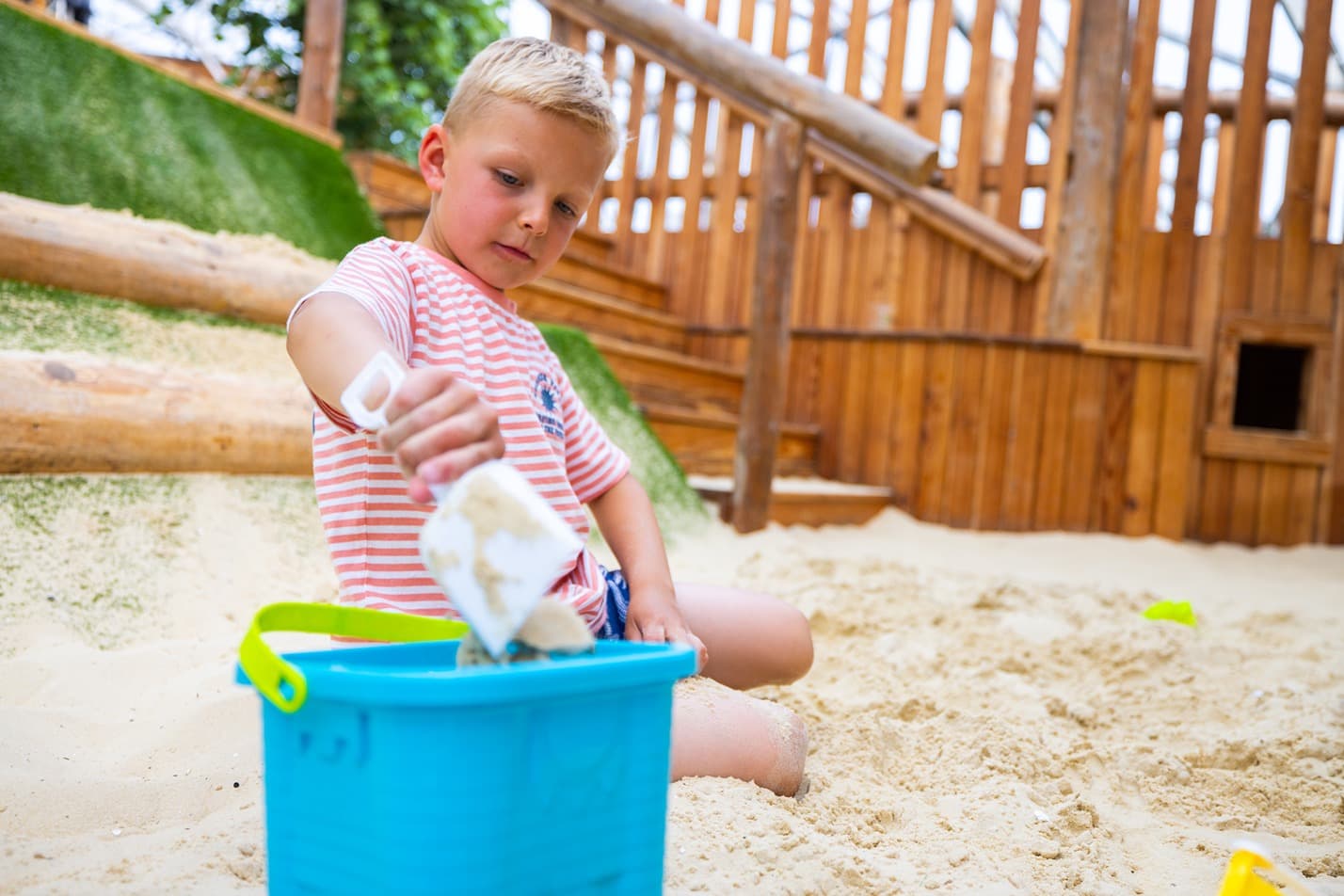 sandplay child with bucket and spade