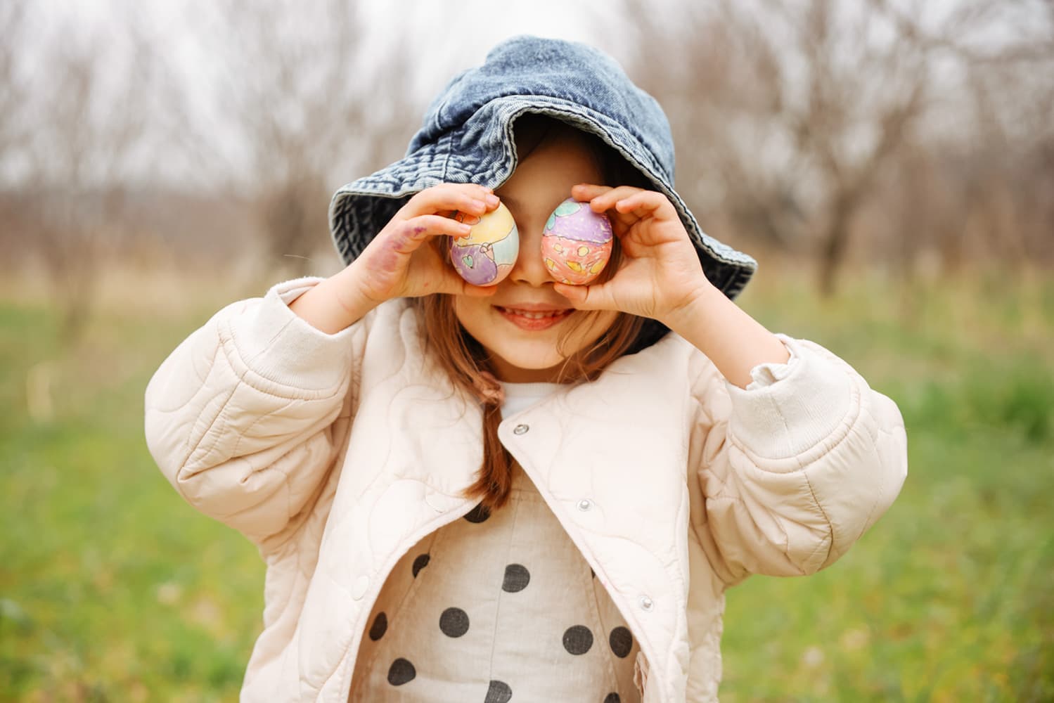 The Great Big Easter Egg Hunt Girl Holding Coloured Egg