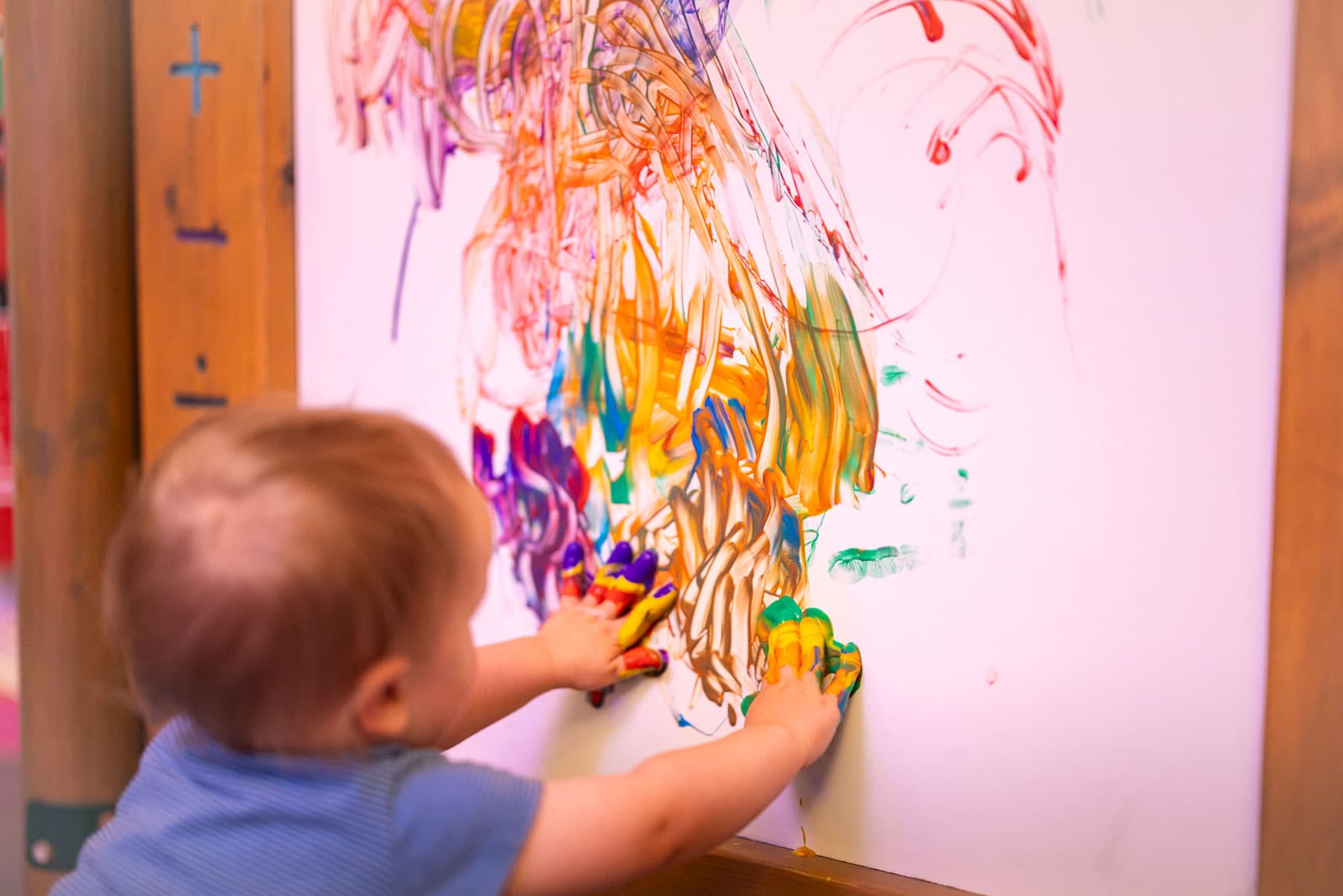Child Painting With Hands At Messy Play