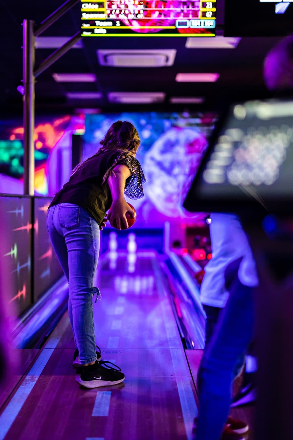 Glowzone Bowling in The Hive teenager bowling