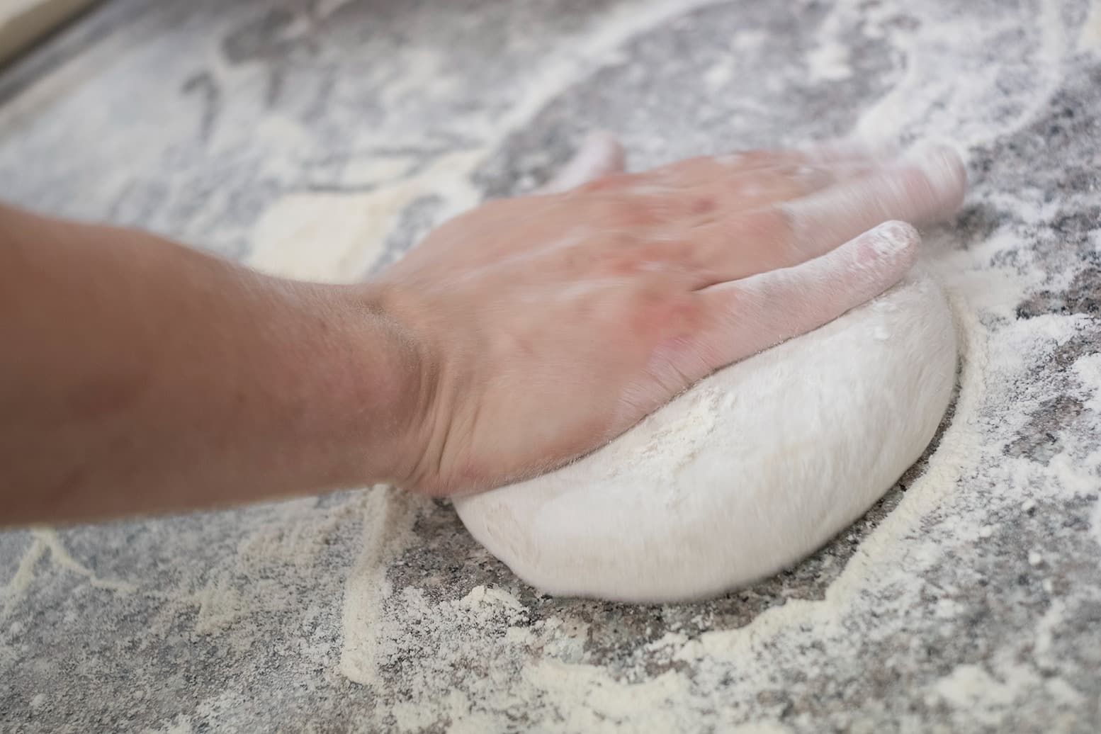Pizza Dough Being Rolled